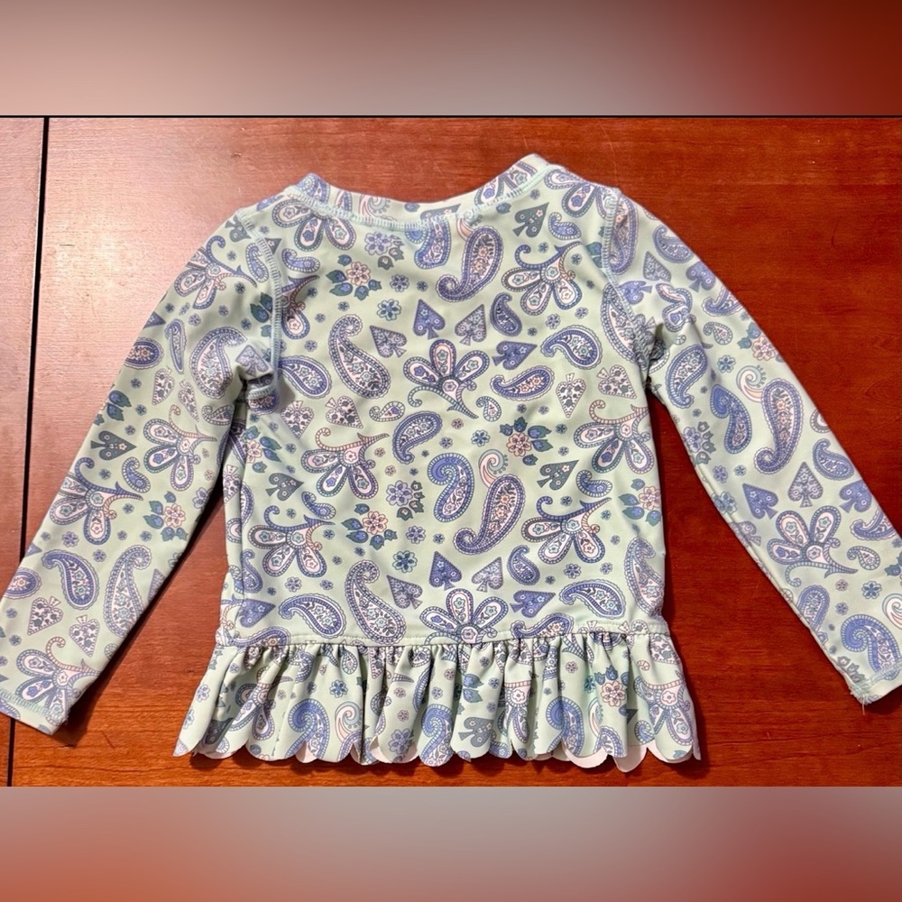 RuffleButts • Sea Glass
Paisley Rash Guard • Size 3t - Picture 3 of 7
